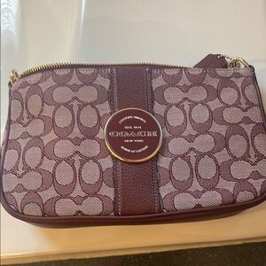 Coach Purple Clutch with Monogram Pattern and Central Stripe